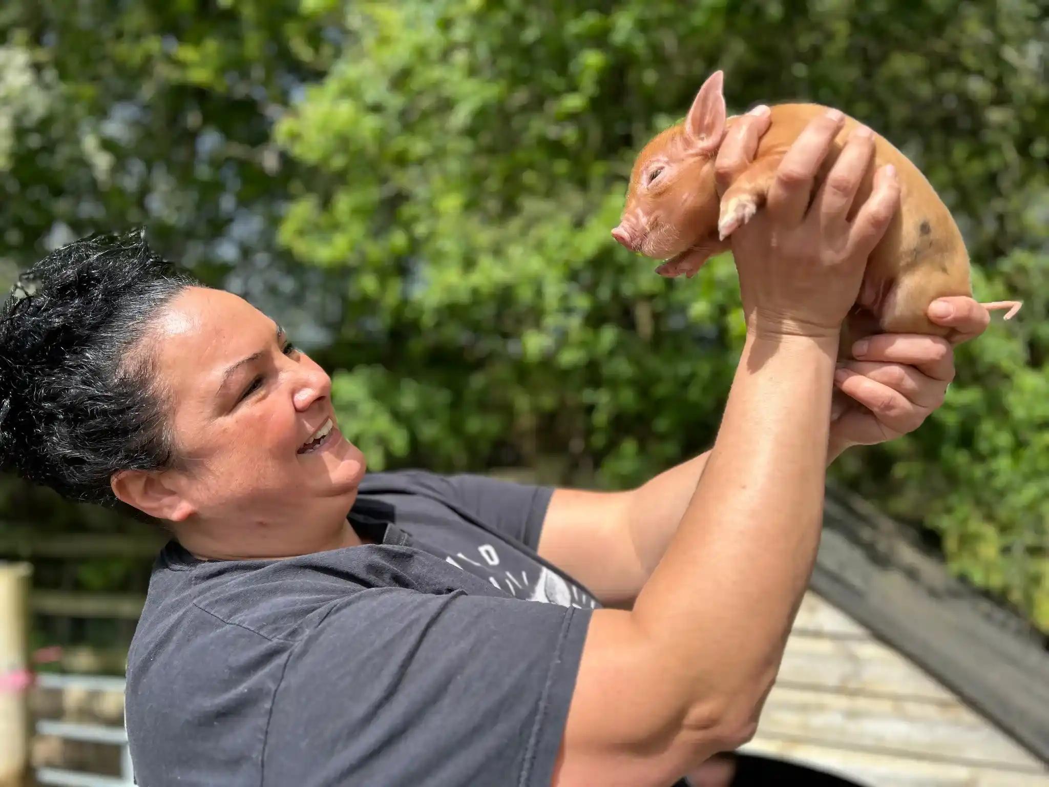 Founder Olivia Holding a Pig
