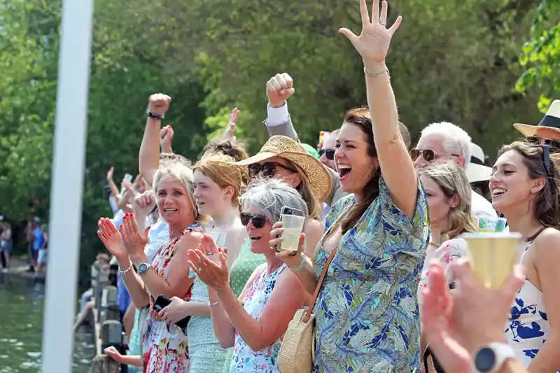 People cheering at the regatta